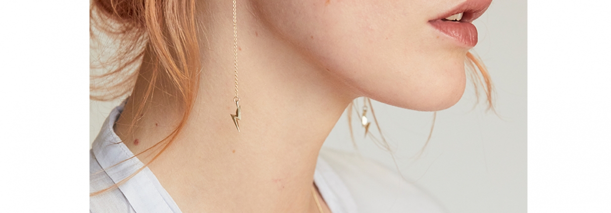 Lightning bolt earrings on chains and wires model on Eva by William Cheshire Bespoke and Cult London Jeweller